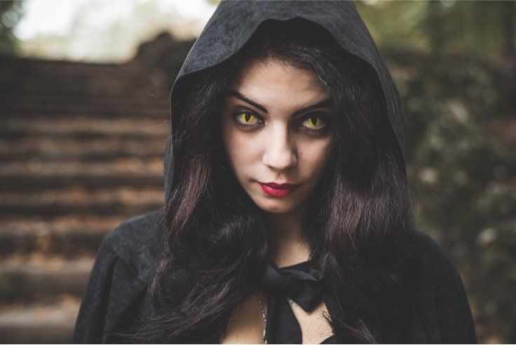 woman with theatrical yellow contacts