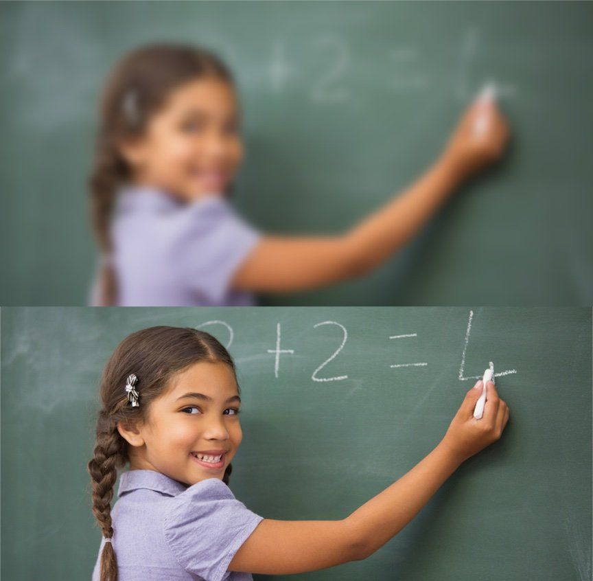 Blurry girl at chalkboard compared to not blurry