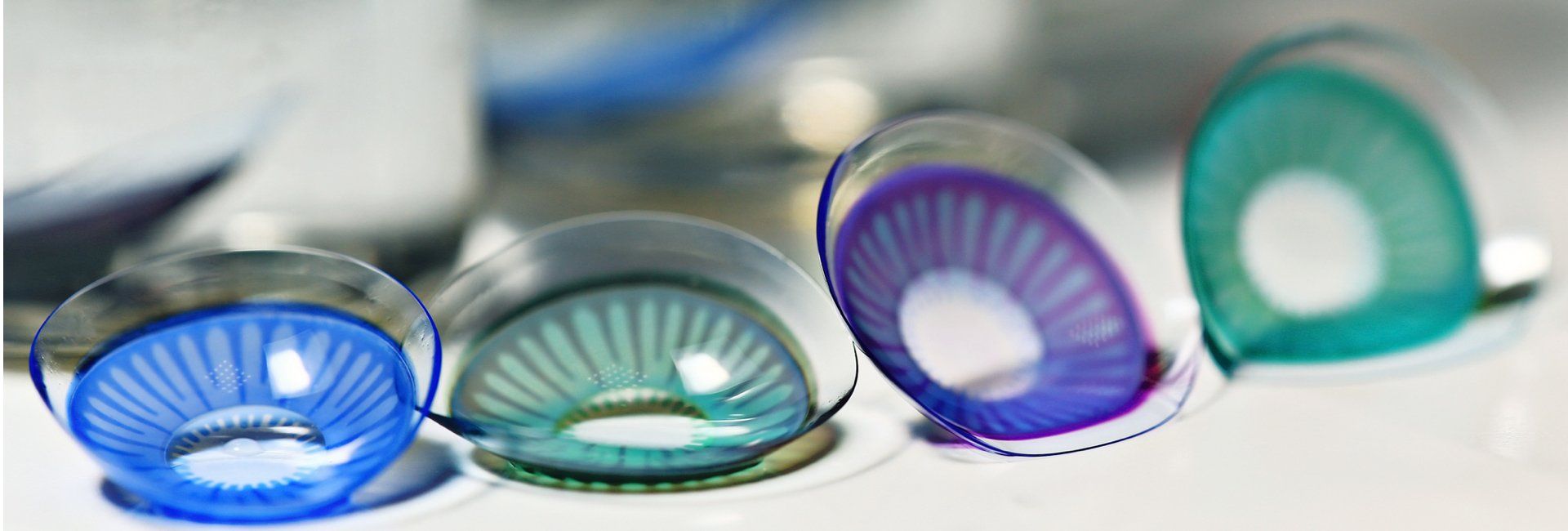 Blue, green and purple cosmetic contact lenses