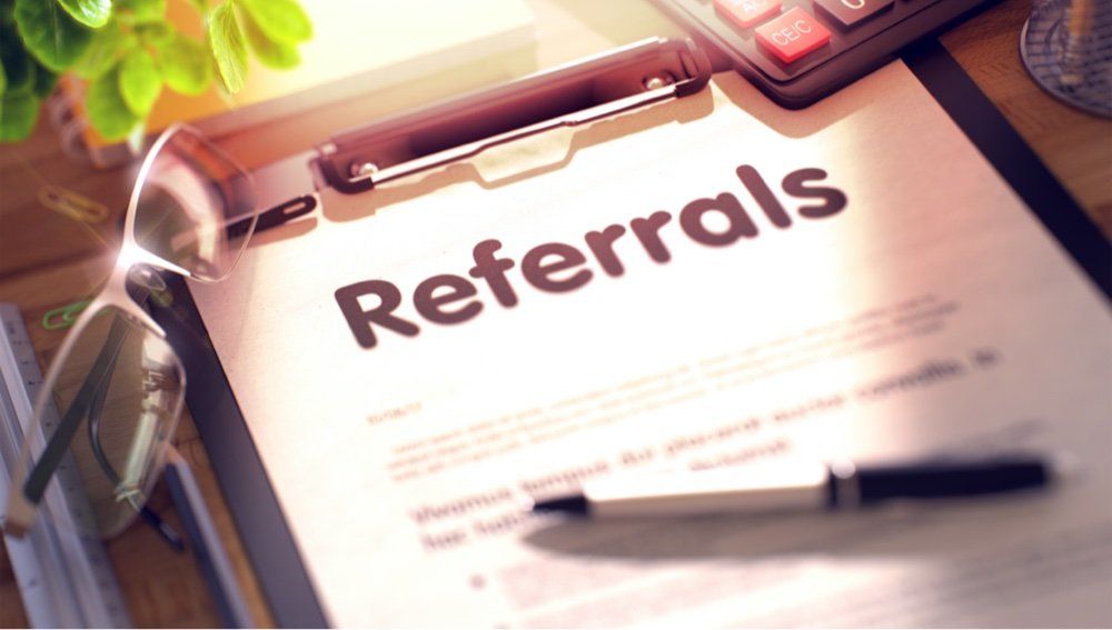 Clipboard with a page titled referrals