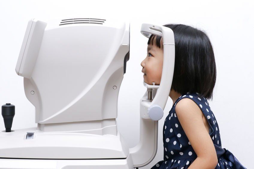 Young girl receiving an eye exam
