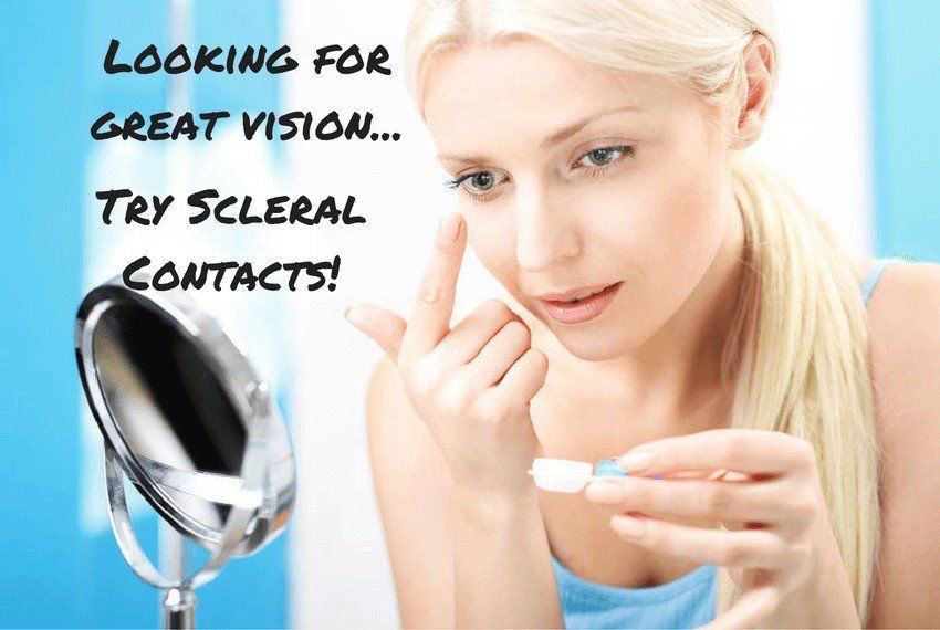 A woman is looking at herself in a mirror with the words looking for great vision try scleral contacts