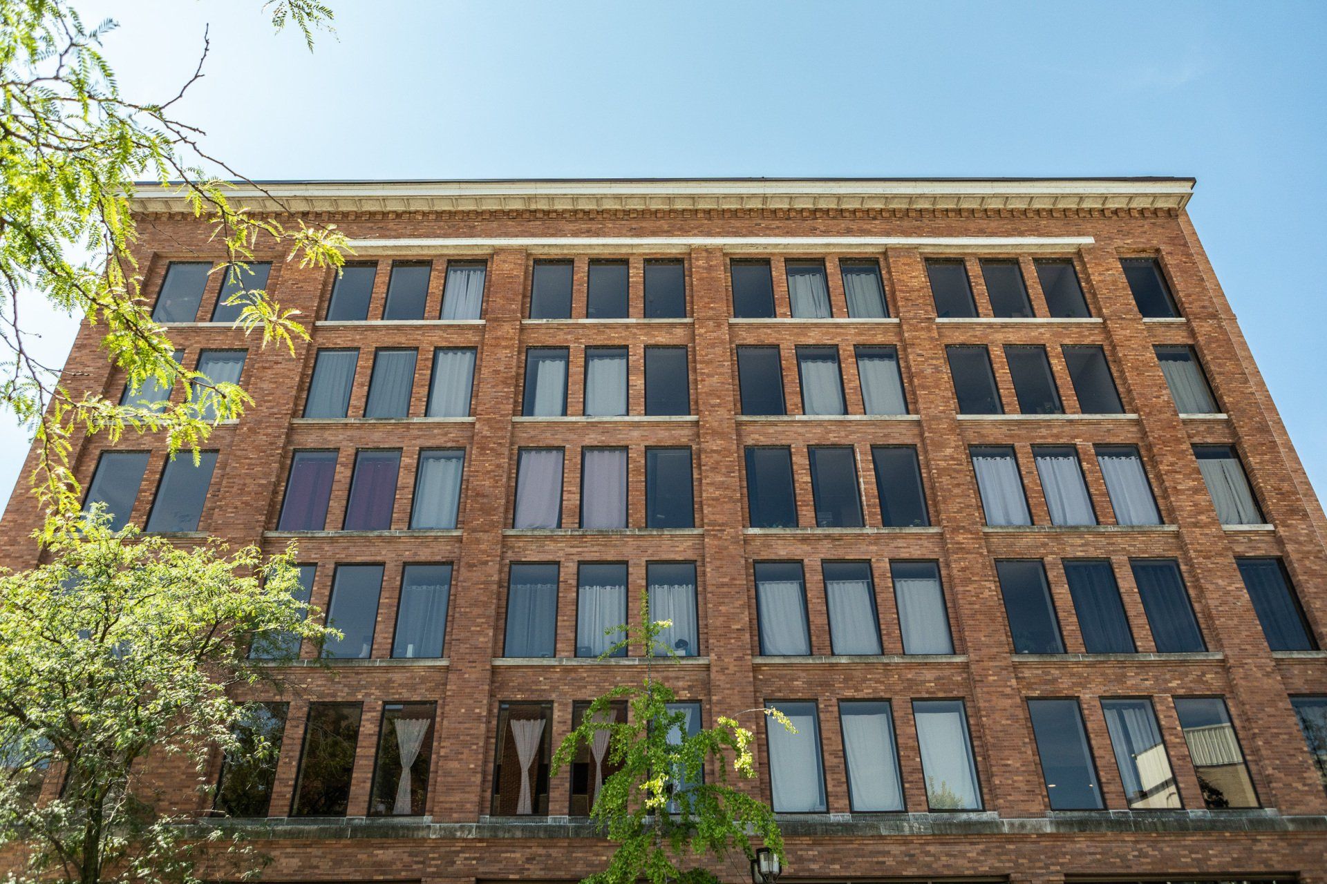 Exterior of building with large wall of windows