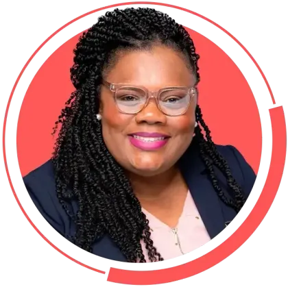 A woman with braids and glasses is smiling in a red circle