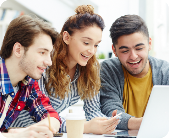 A group of young people are looking at a laptop computer.