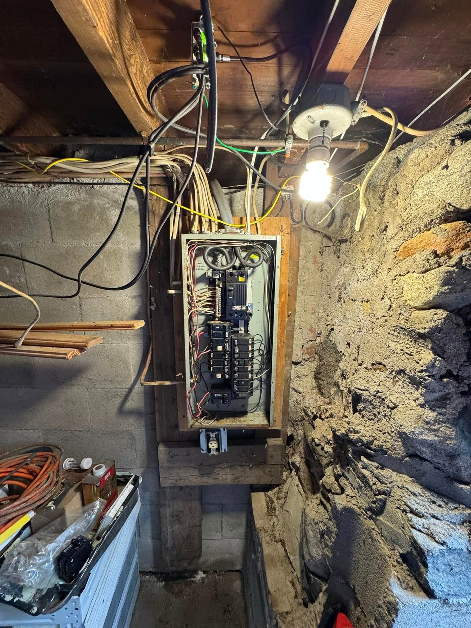 A wooden fence is sitting on top of a lush green field.