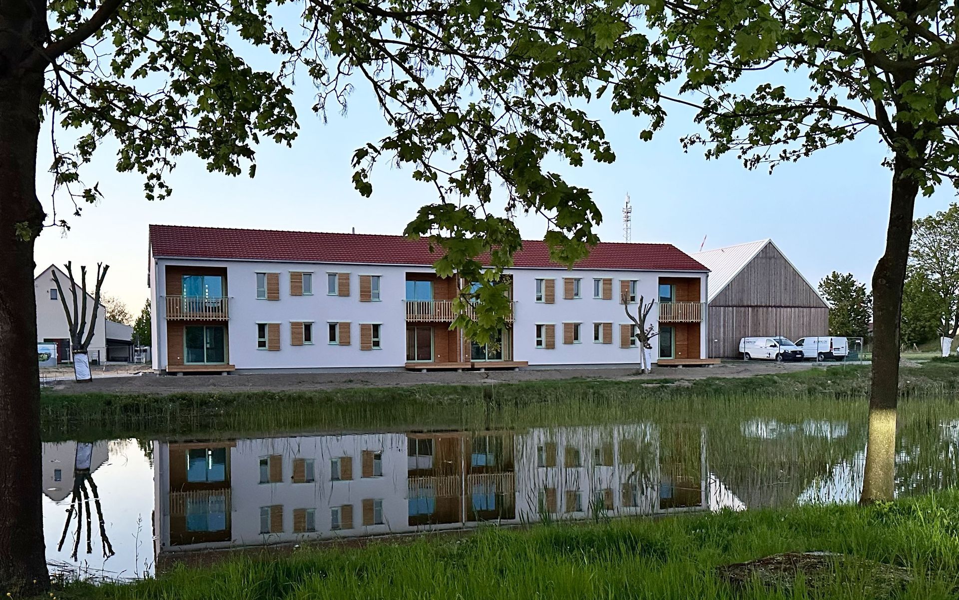 An aerial view of a house under construction in a rural area.