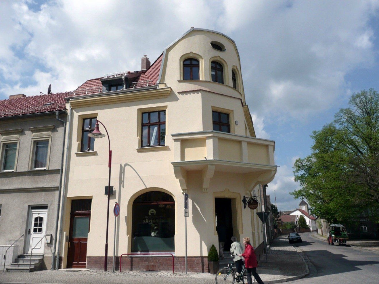A building with a balcony on the top of it