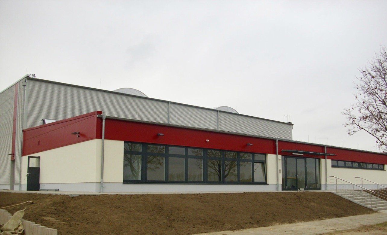 A red and white building with a lot of windows