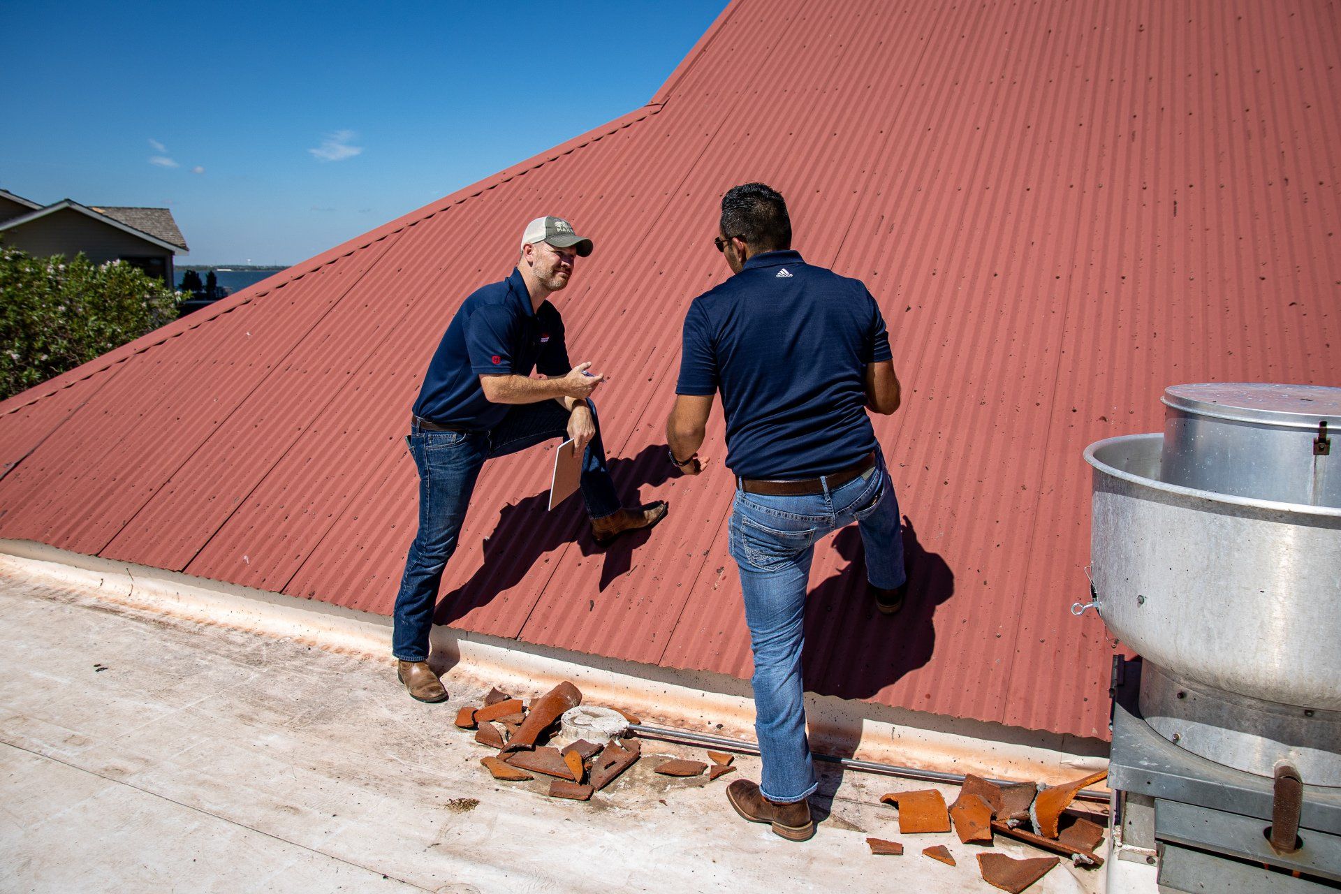 Roofers Inspecting a Metal Roof