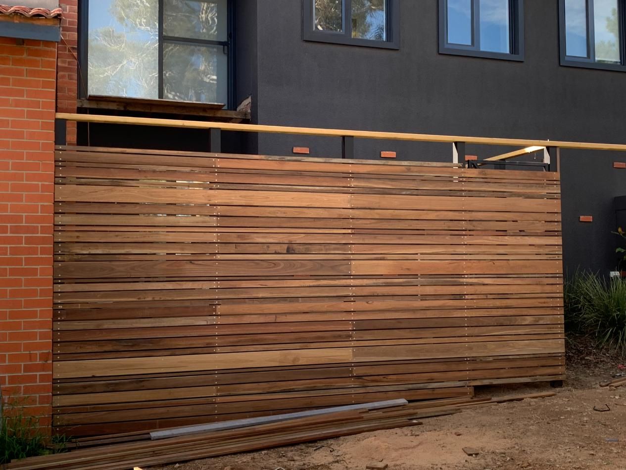 A Circular Saw Is Cutting A Piece Of Wood — Renovo Contractors In Monash, ACT