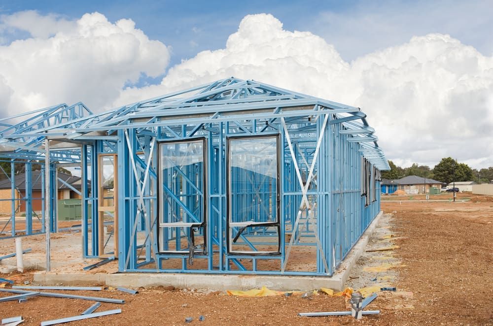 A House Is Being Built With A Metal Frame — Renovo Contractors In Monash, ACT