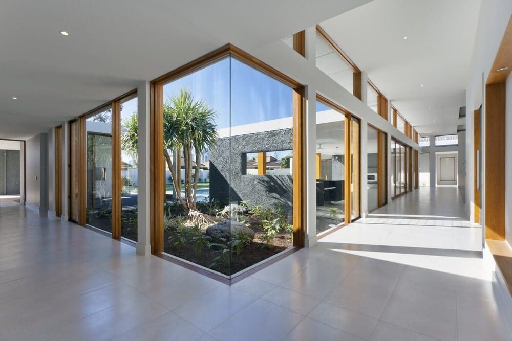 A Hallway In A House With A Lot Of Windows — Renovo Contractors In Monash, ACT