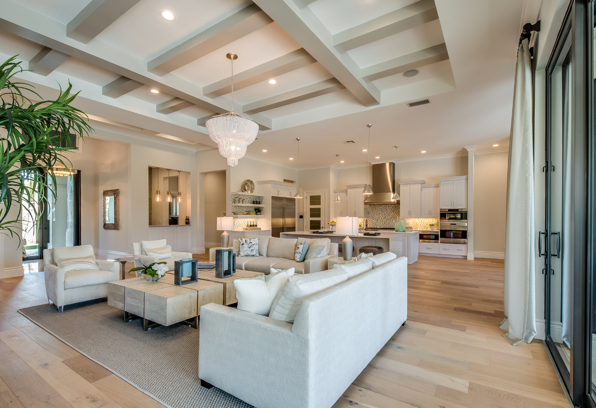 A living room filled with furniture and a chandelier.