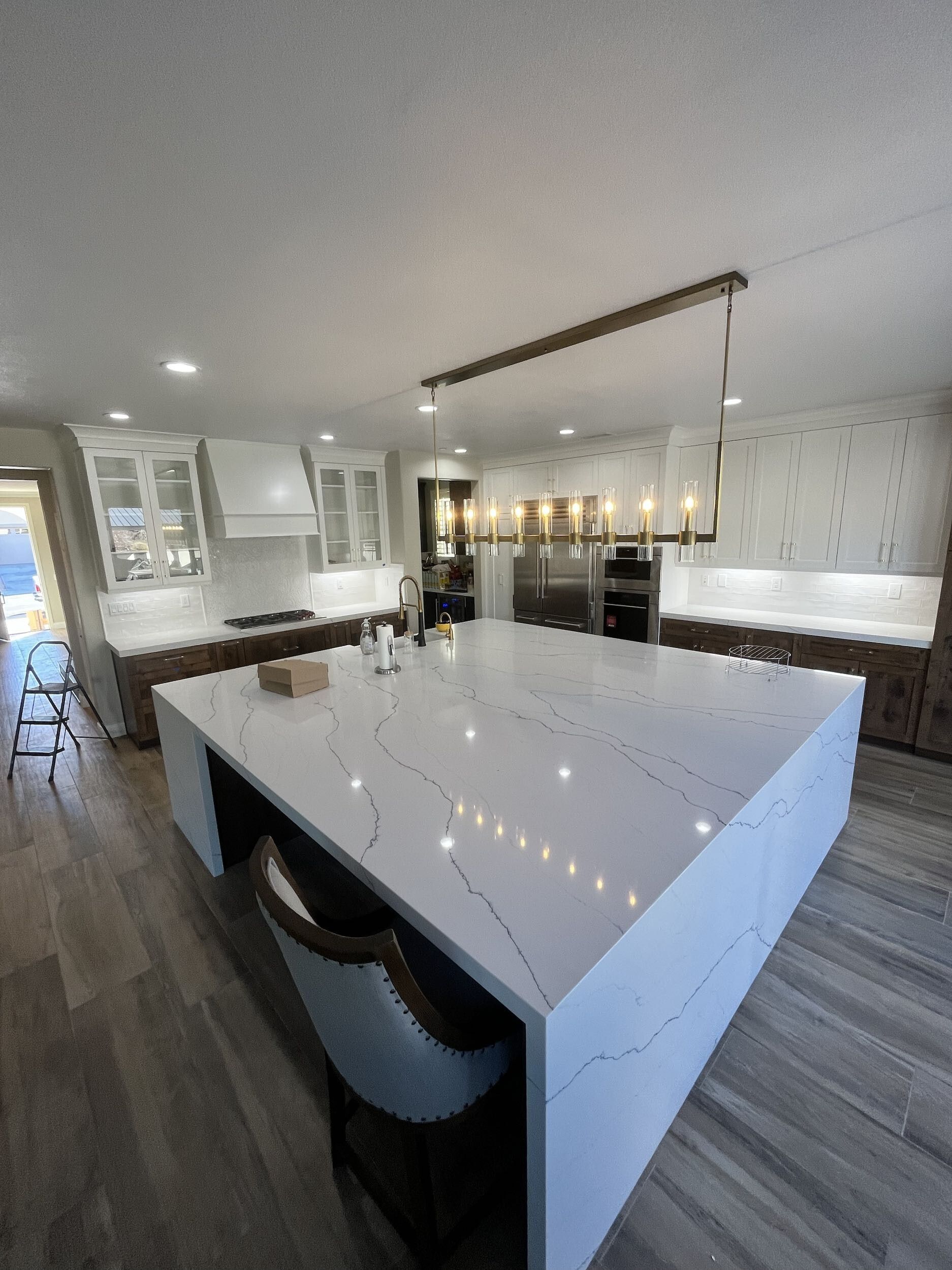 There is a large island in the middle of the kitchen.