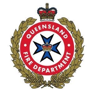 Queensland Fire Department emblem: Red, white, and blue crest with a crown, surrounded by a wreath.