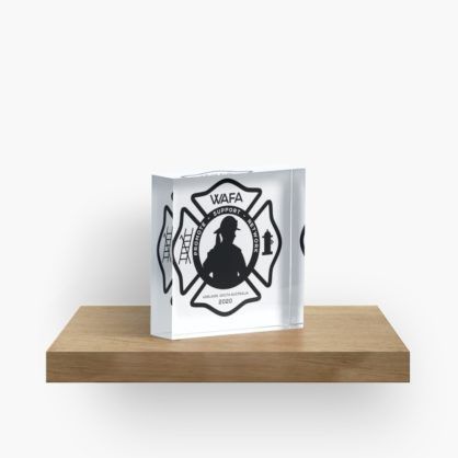Acrylic block featuring a firefighter silhouette in a Maltese cross.
