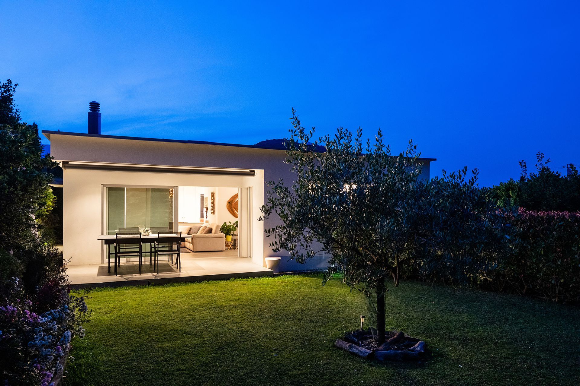 Annexe in garden at night with lights on