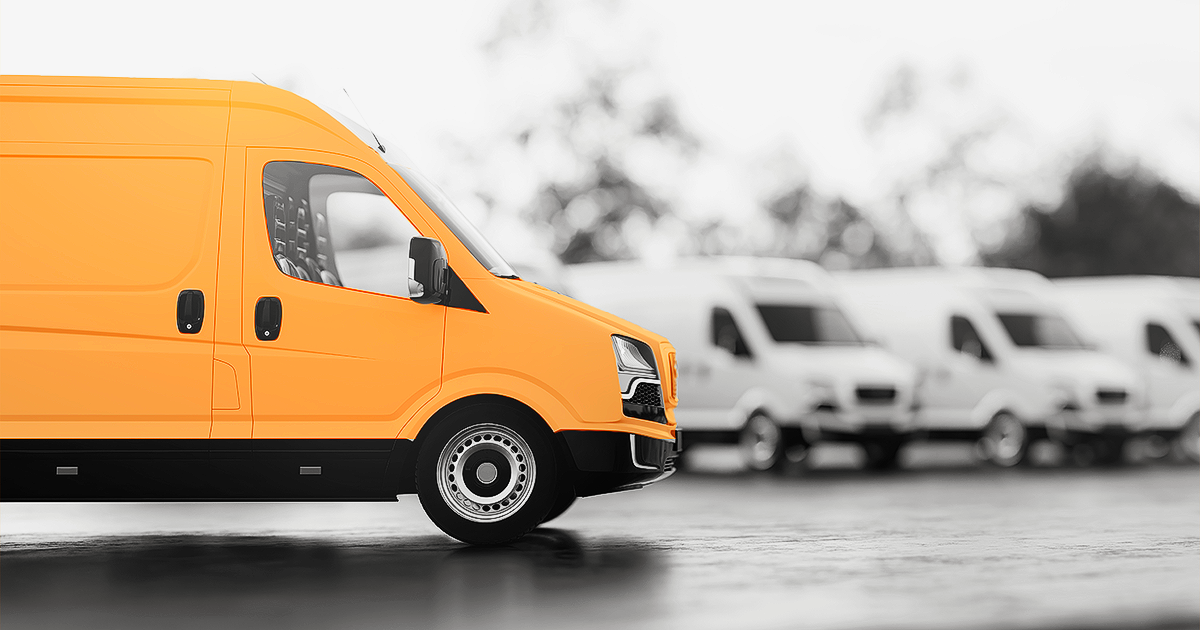 Pangea orange van with fleet vehicles in background