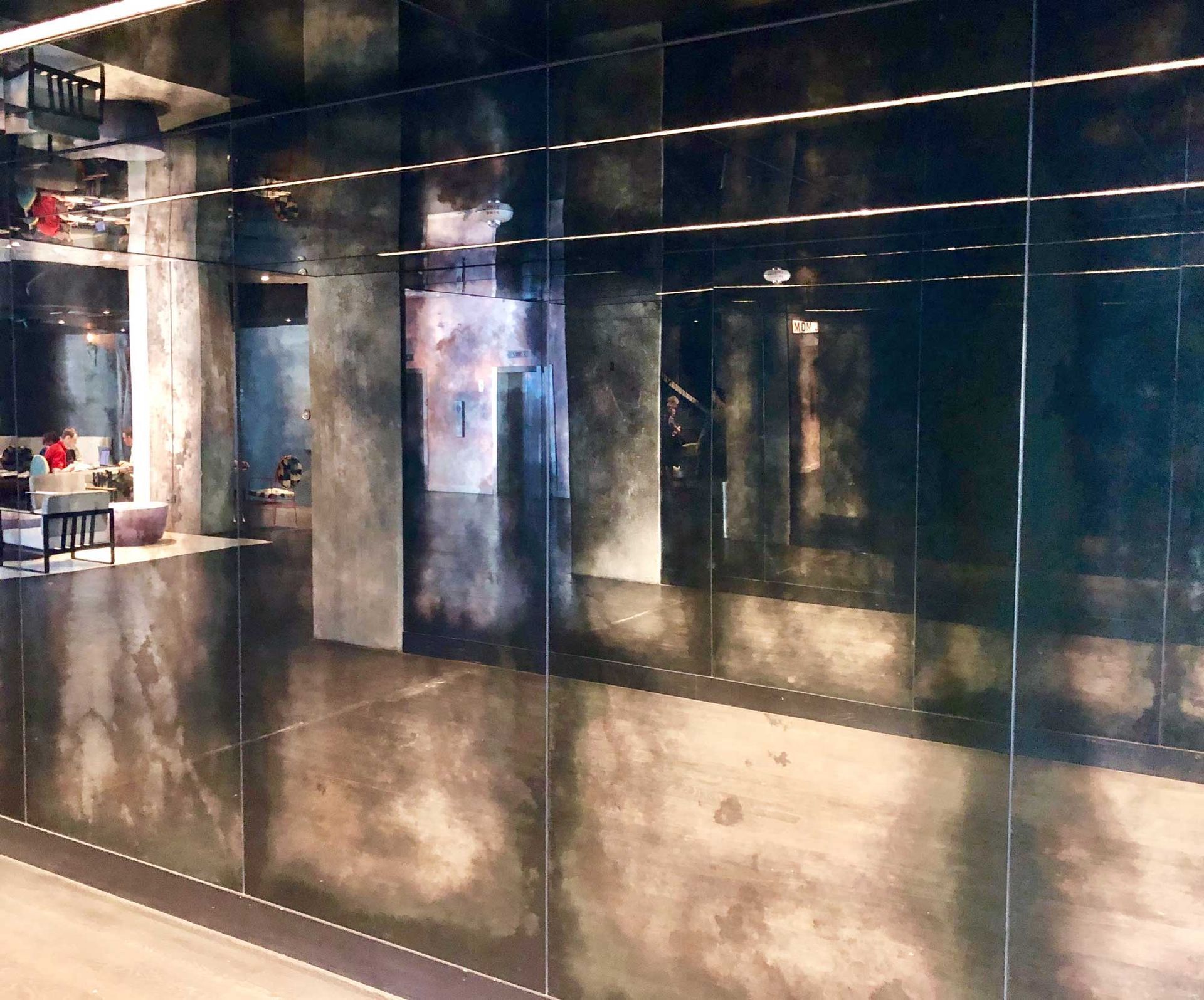 A room with a lot of antique mirrors on the wall
