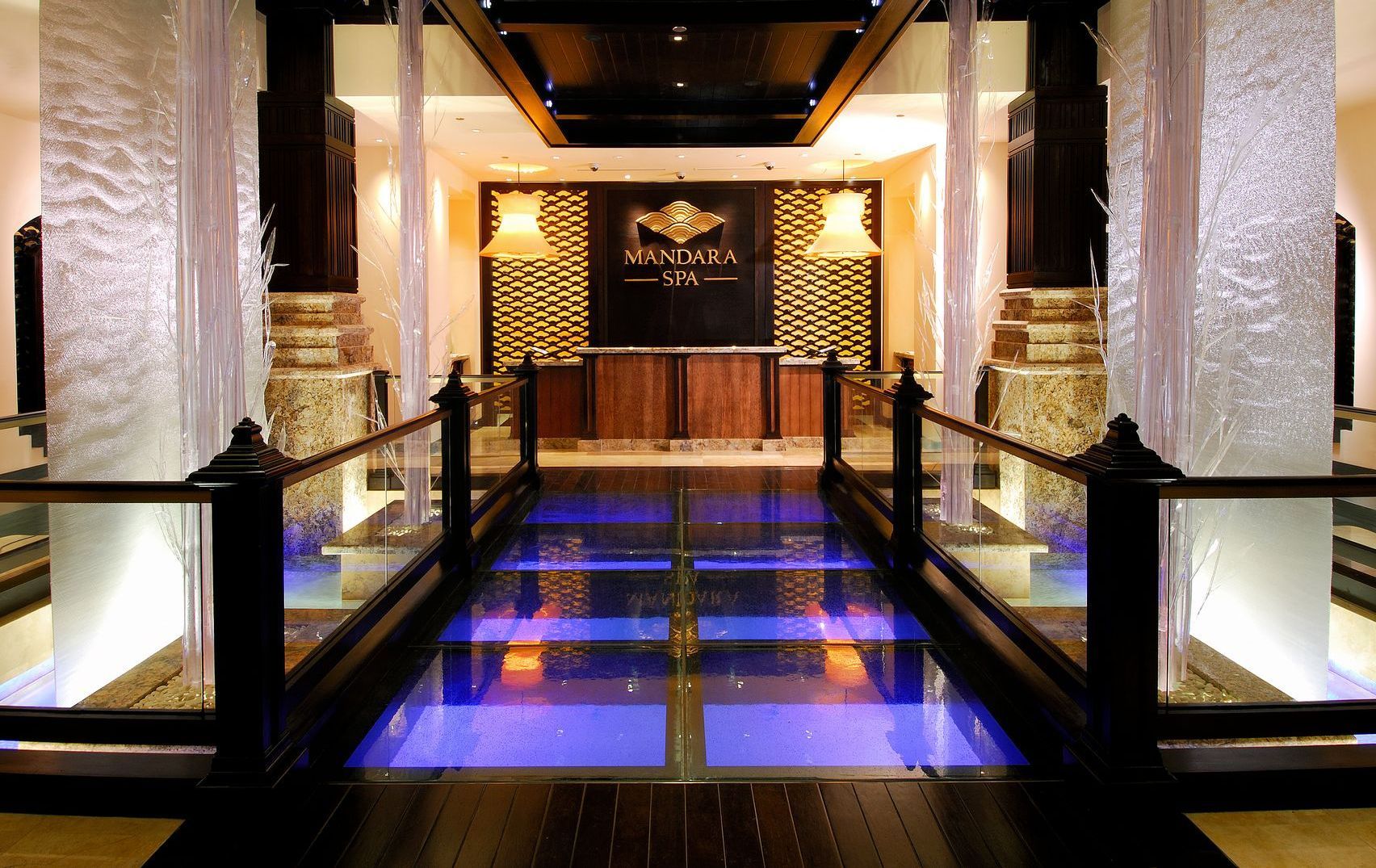 A glass floor hallway with a sign that says ' the edge ' on it