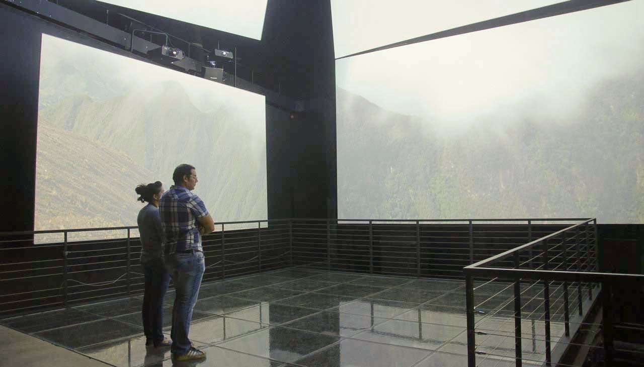 A man and a woman are standing on museum glass flooring