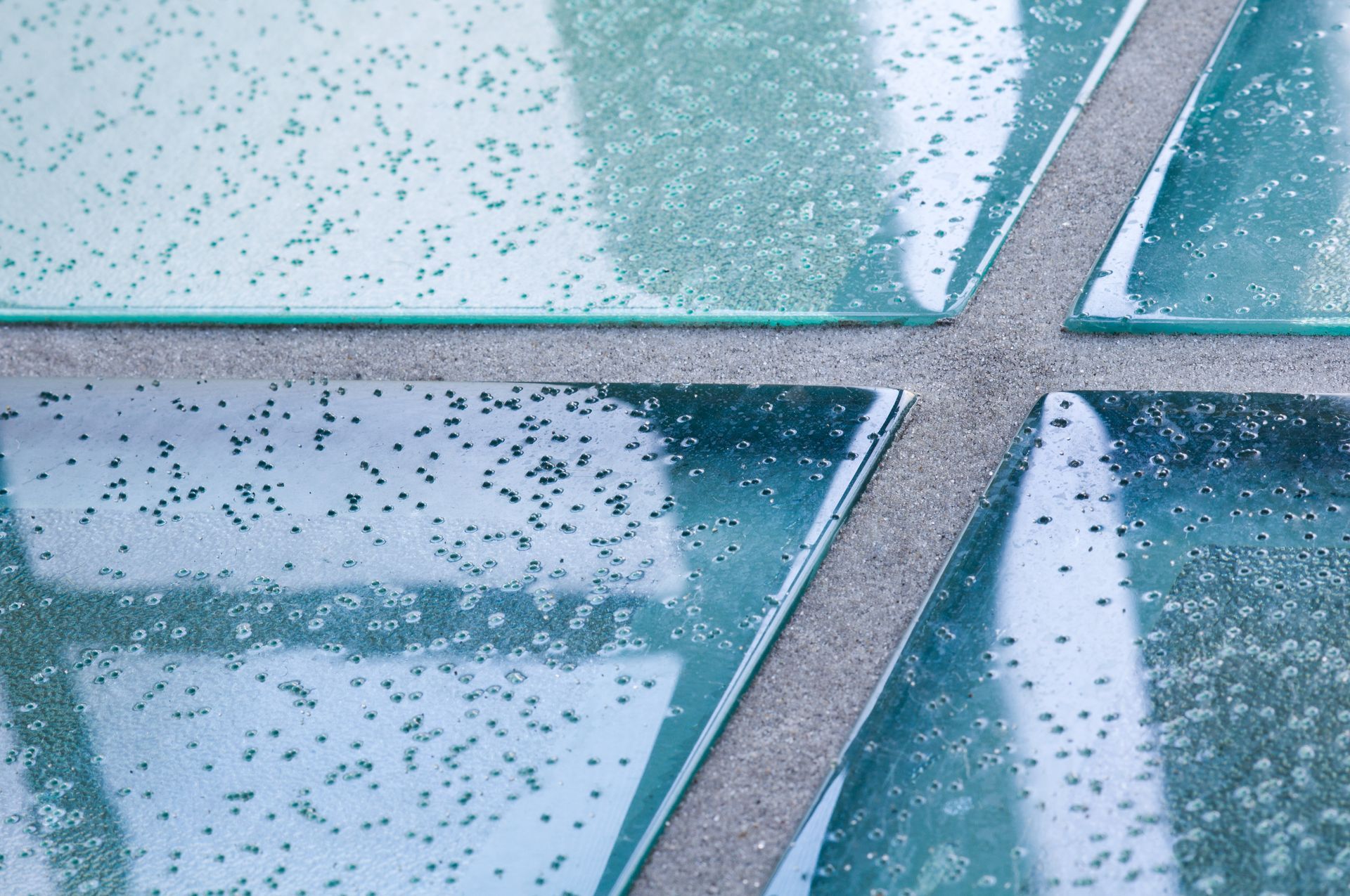 A picture of glass flooring with anti-slip glass texture clearly visible.