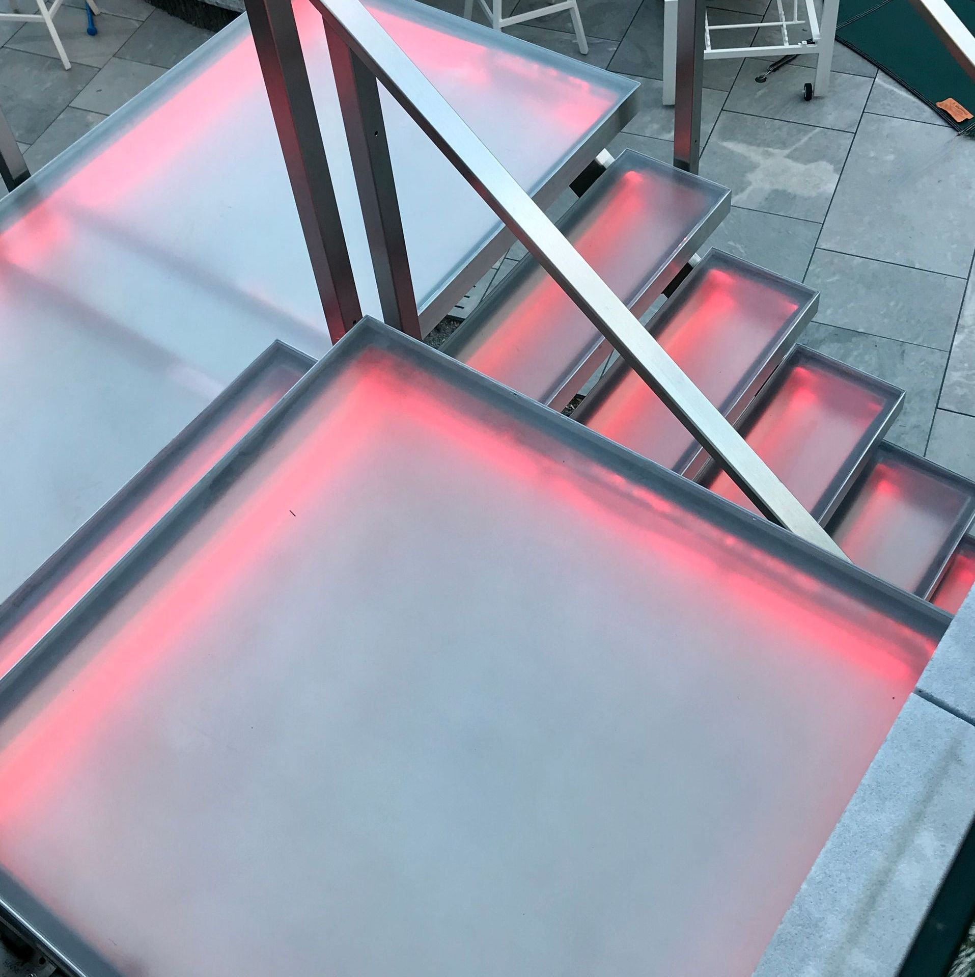 private residence pink highlighted glass staircase