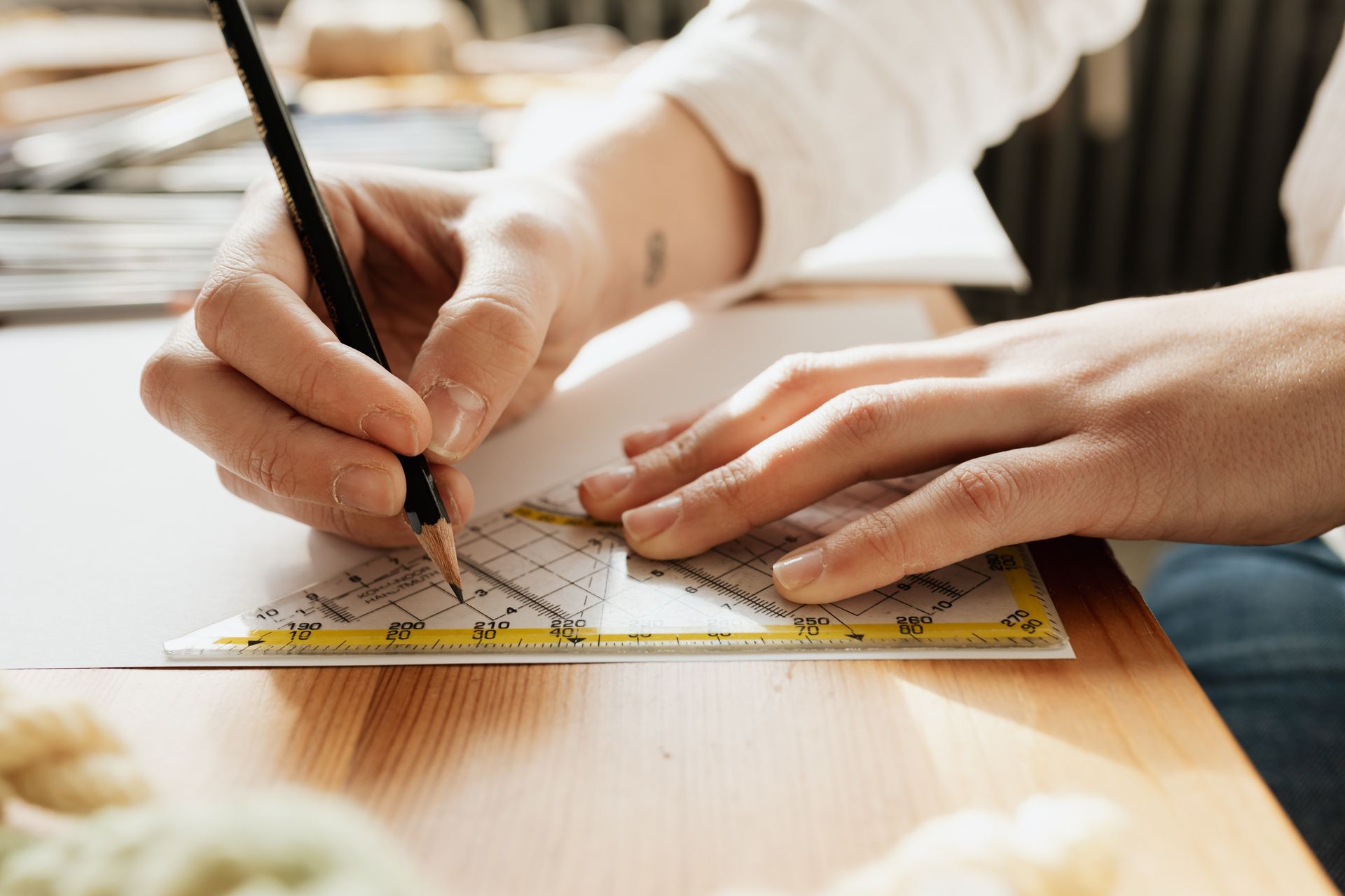 An engineer working on glass flooring calculations. 