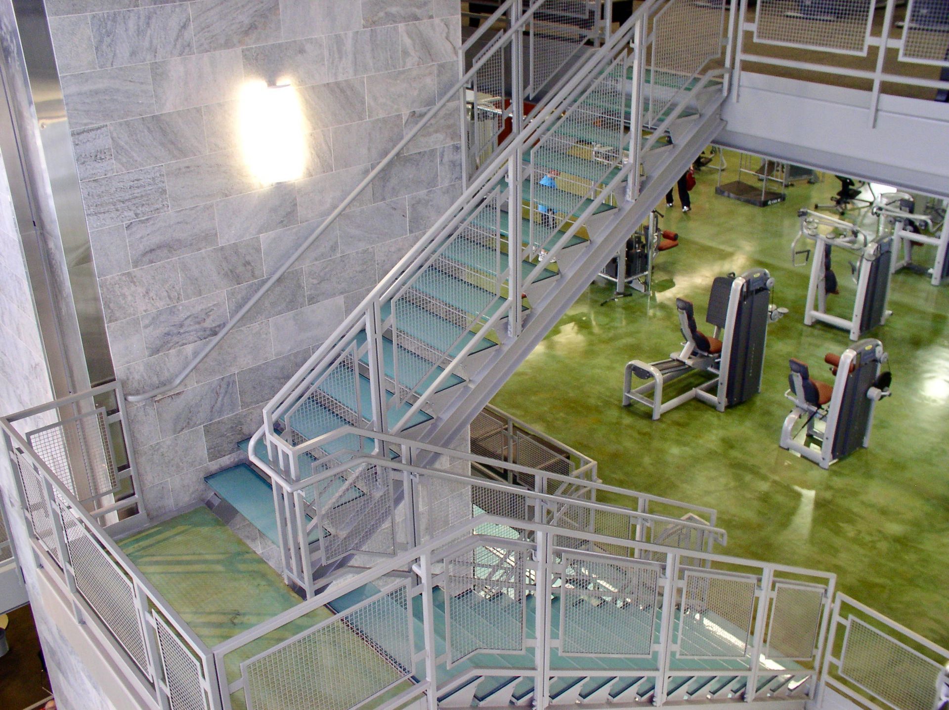 glass staircase at Gold Gym