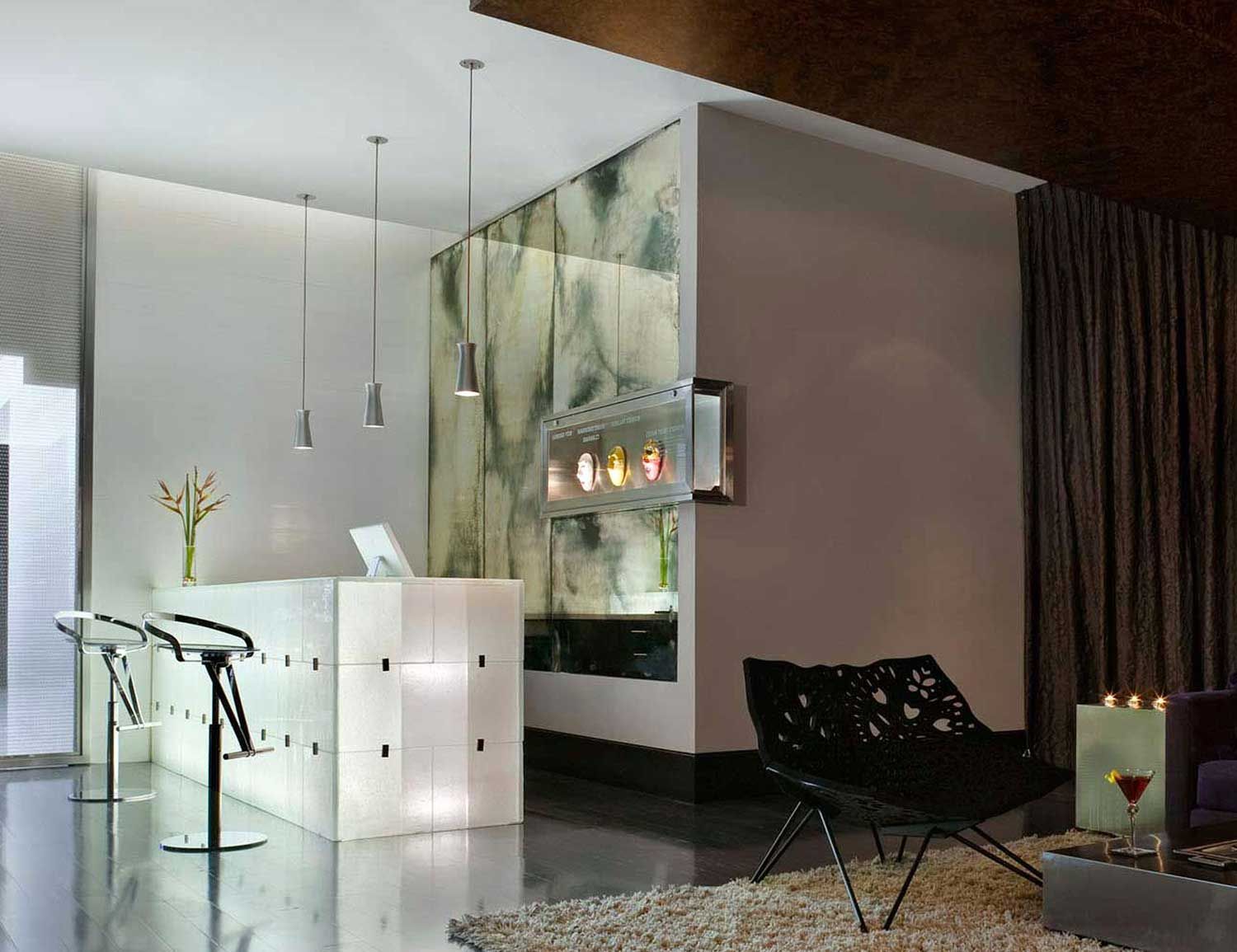 A living room with a bar and a chair