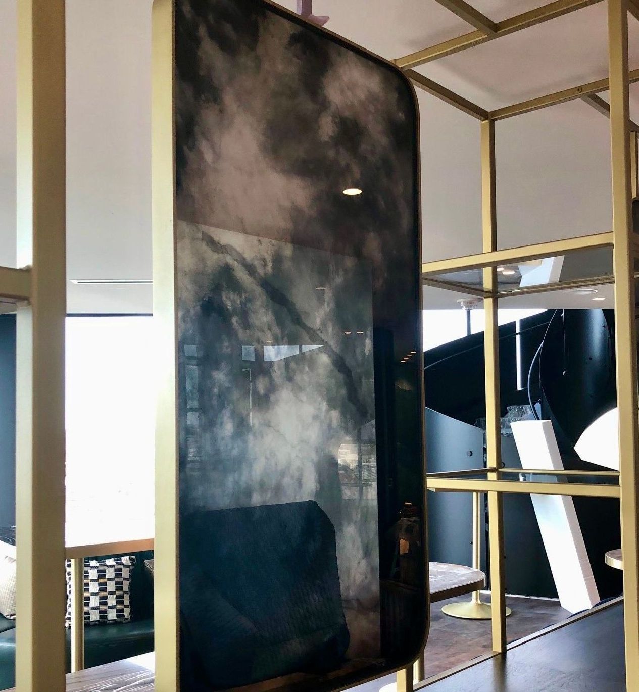A large antique mirror on a wall in a room