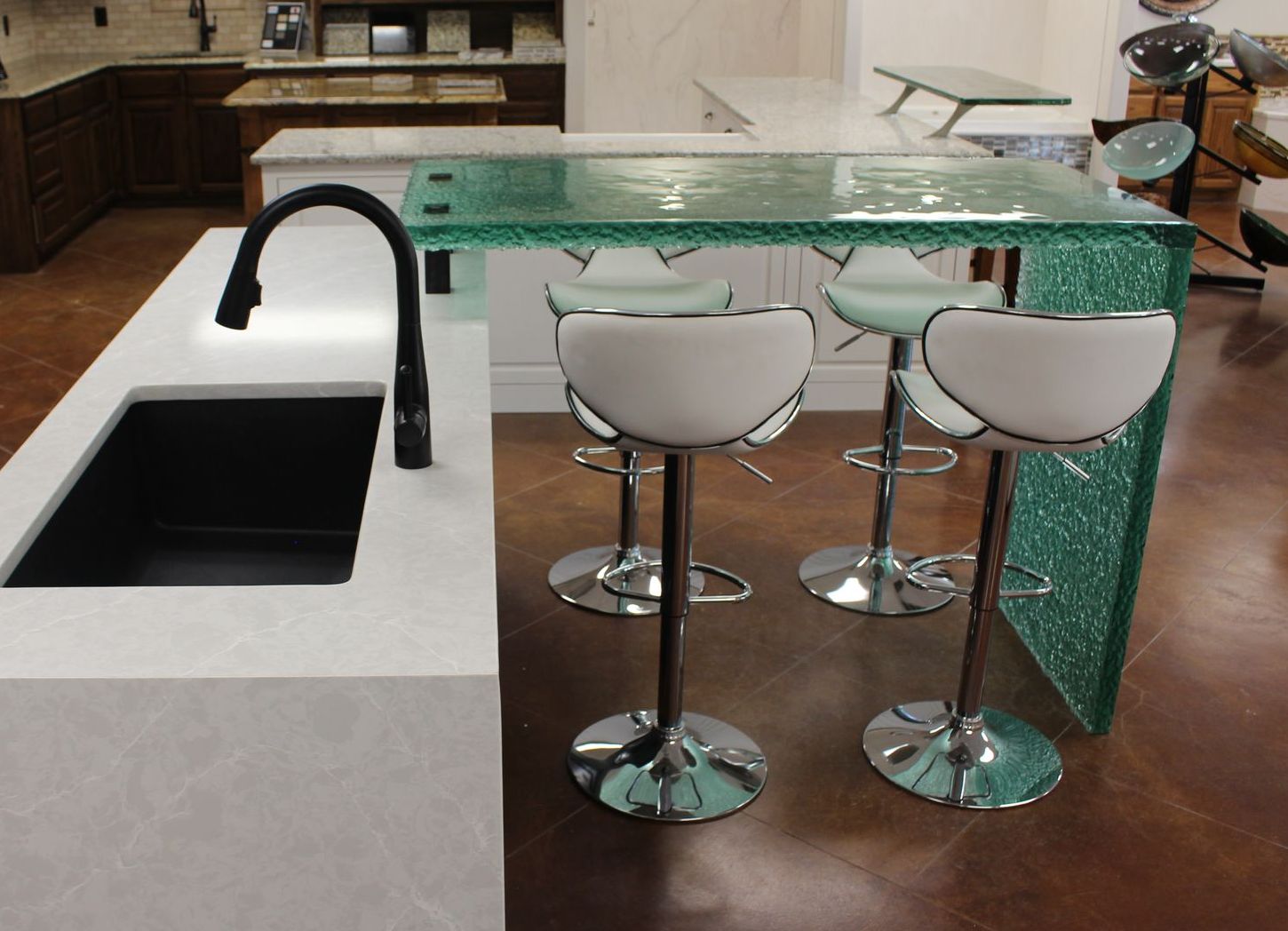 A kitchen with a glass table top