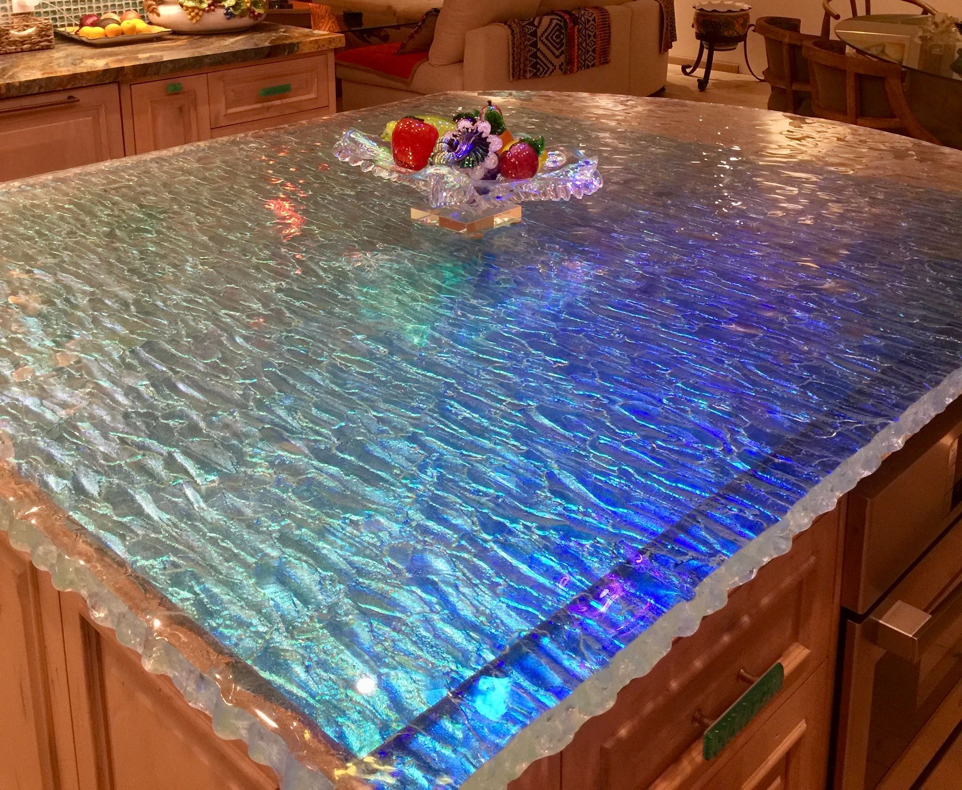 Blue iridescent textured table cover with a small centerpiece and ornaments in a cozy room
