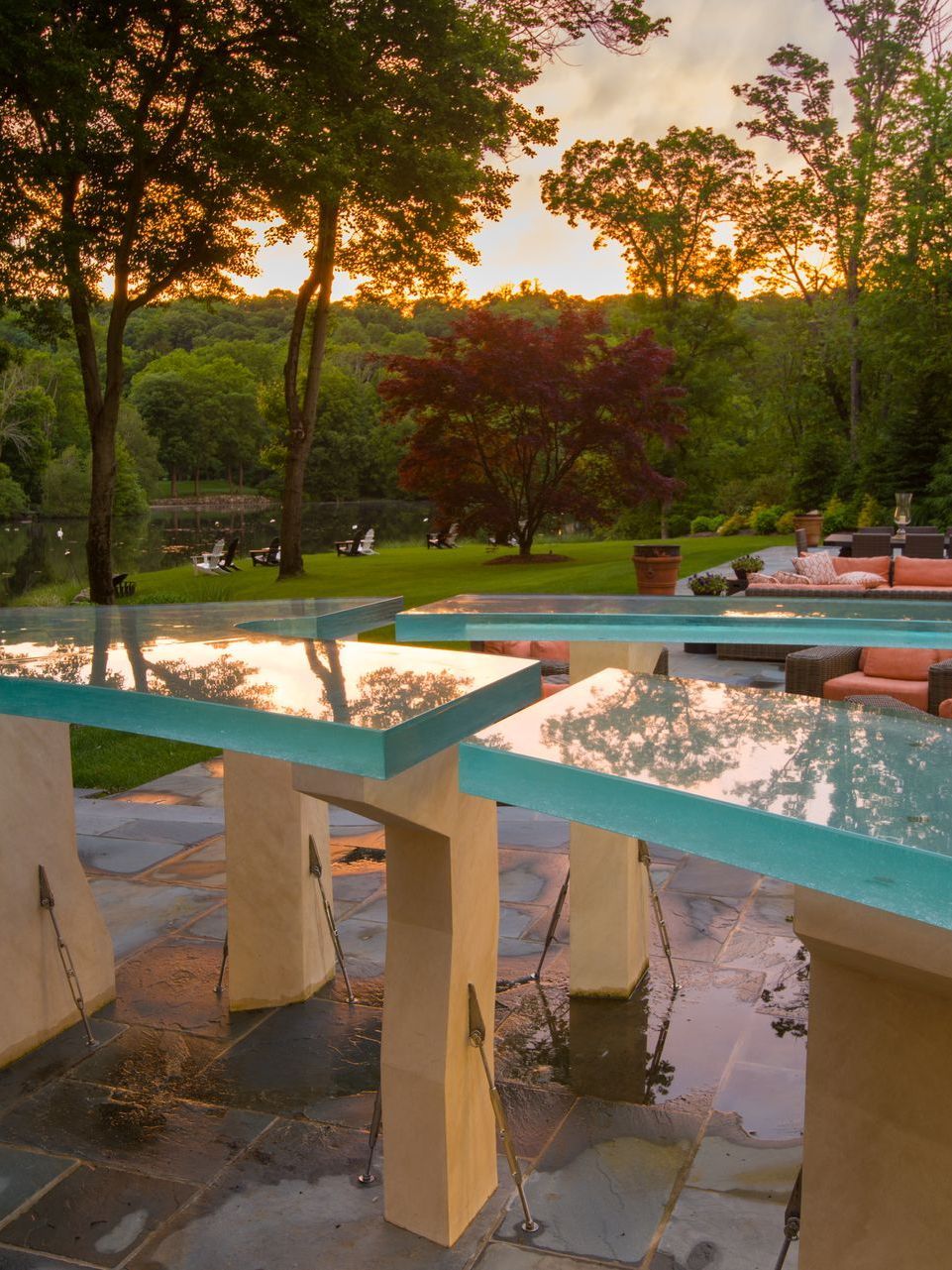 Curved glass countertops in an outdoor living space.