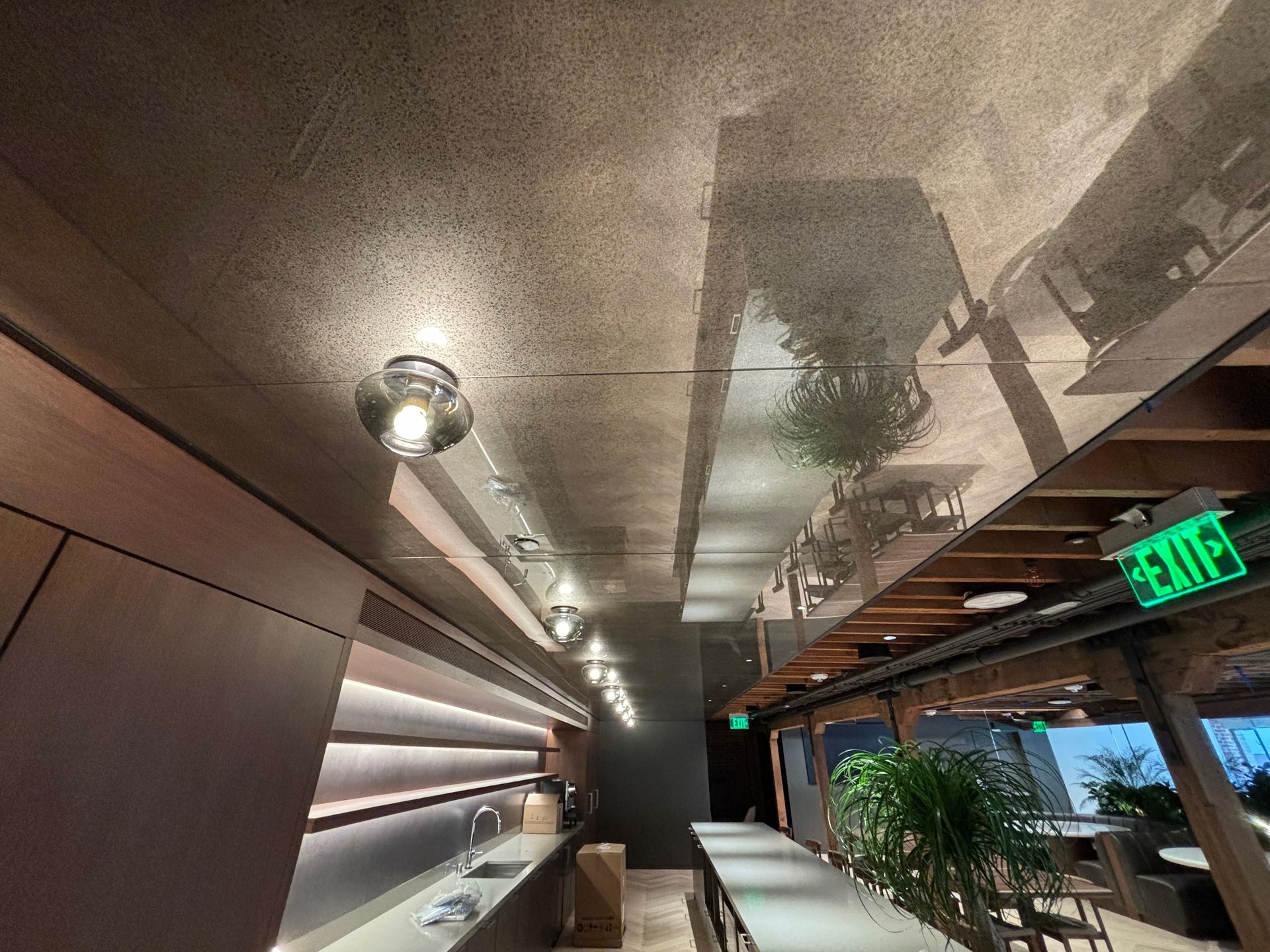 A Maston Miami restaurant with a antique ceiling.