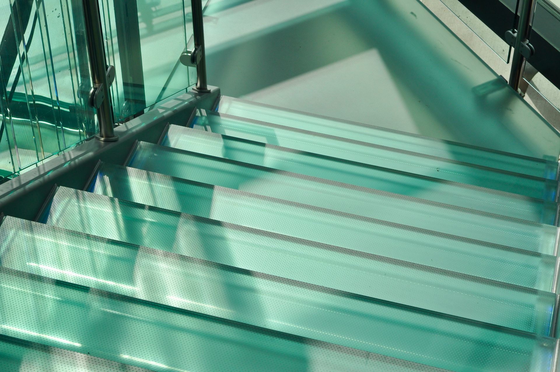 Glass stairs and stair treads with anti-slip glass.