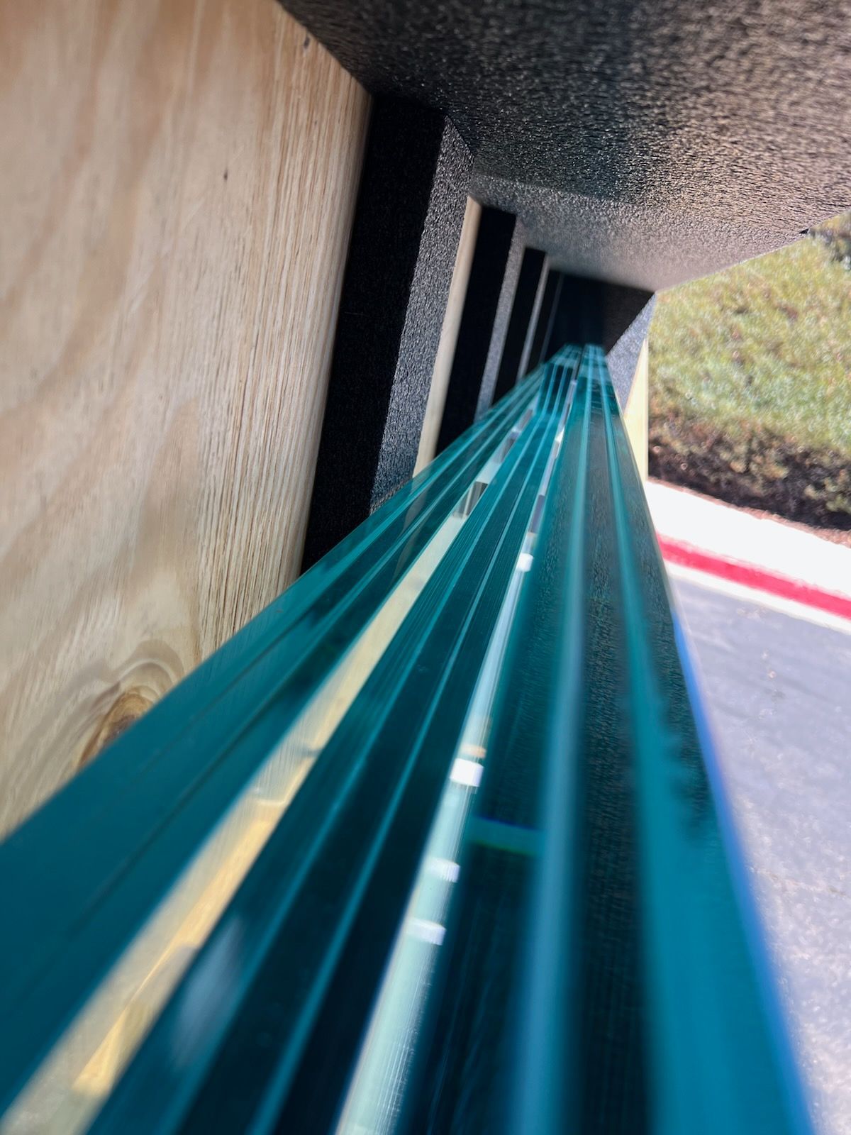 A collection of glass panels being prepared for a safe, secure shipment.