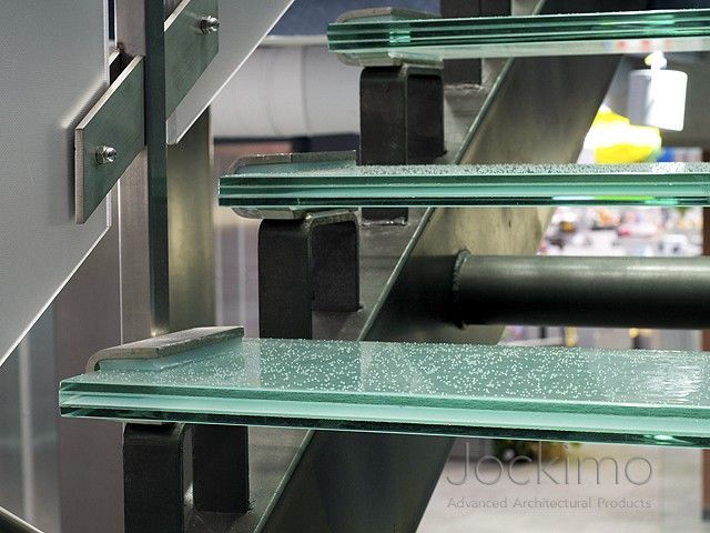 Glass stair treads on a glass staircase.