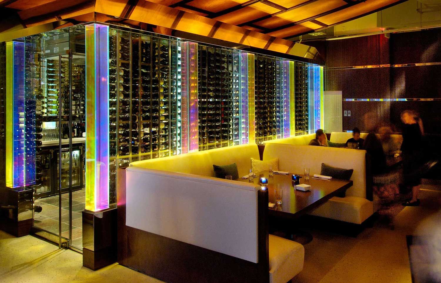 Dichroic glass incorporated into the wine cellar at a restaurant and bar.