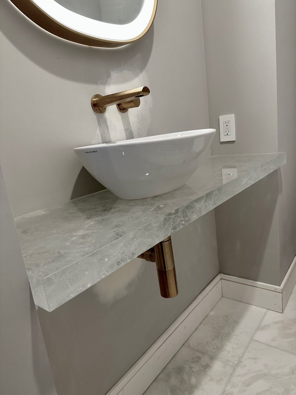 Bathroom countertop installation using ThickGlass™ in Smoke from TCG Glass.