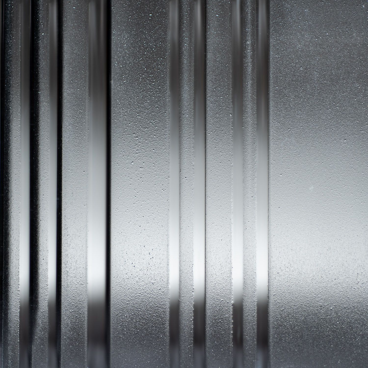 glass corrugated surface with vertical lines.