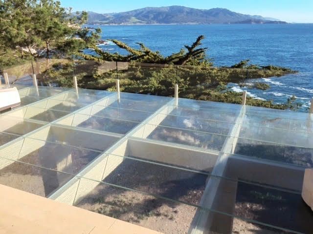 Modern walkable skylight on a property overlooking the ocean.