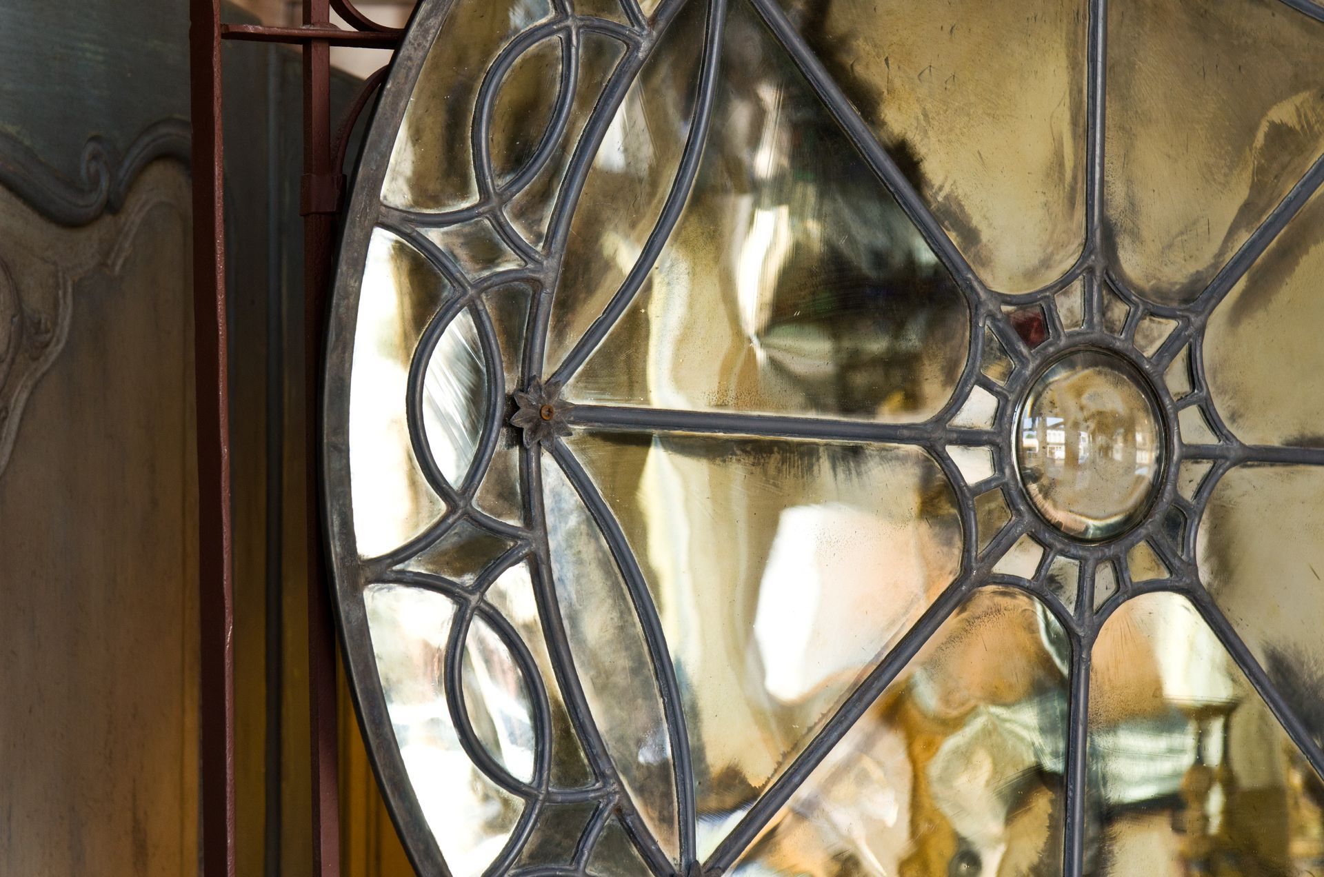 Closeup shot of a framed circular antique mirror