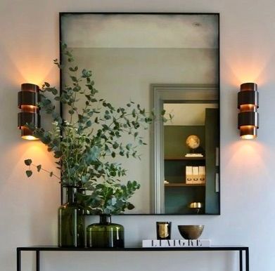 black framed antique mirror on wall
