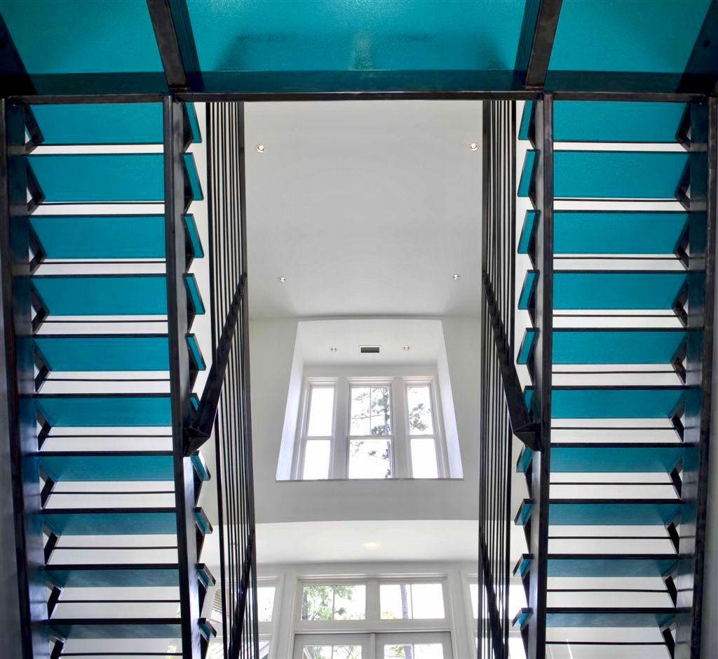 blue glass stairs in private residence