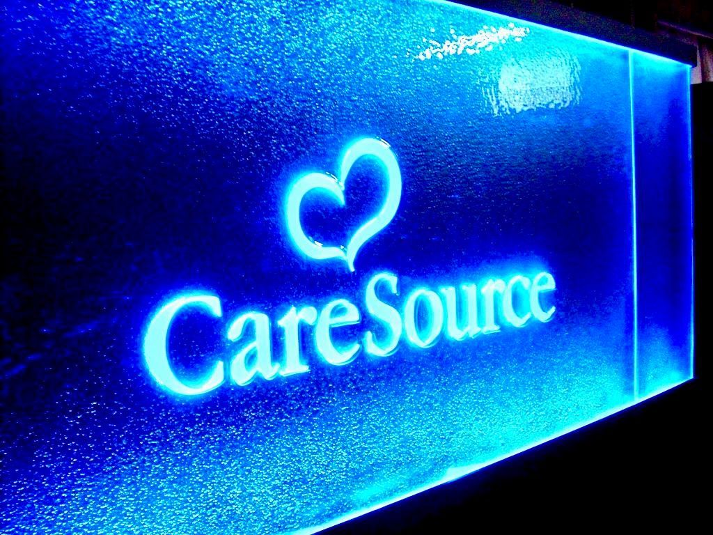 A glowing neon-style sign featuring the white 