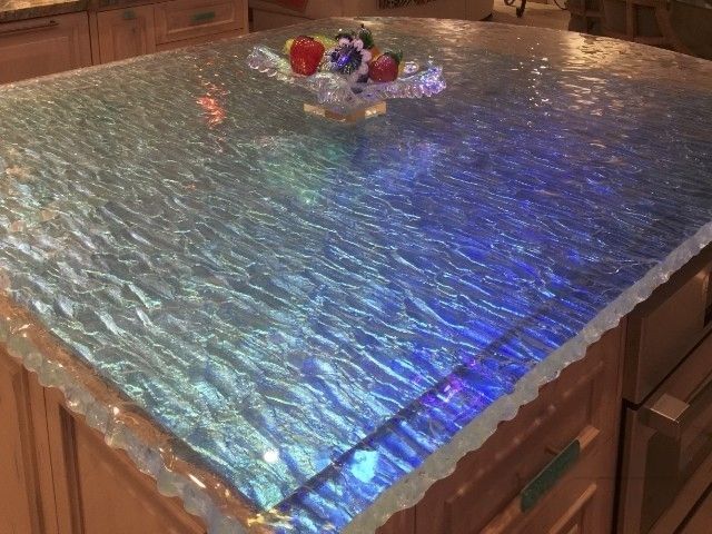 A textured cast glass kitchen countertop in dichroic glass.