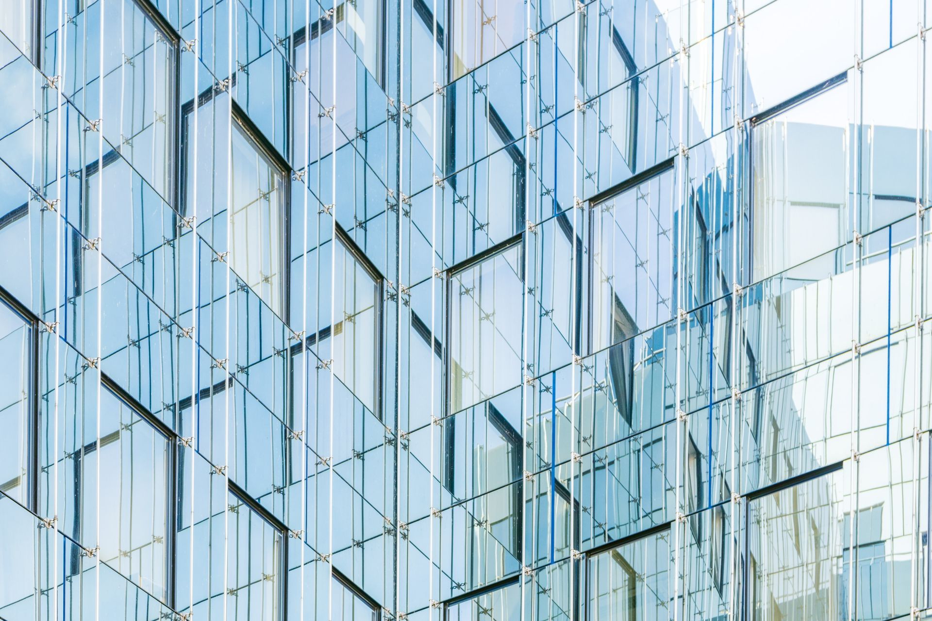 An elegant building constructed of reflective glass.