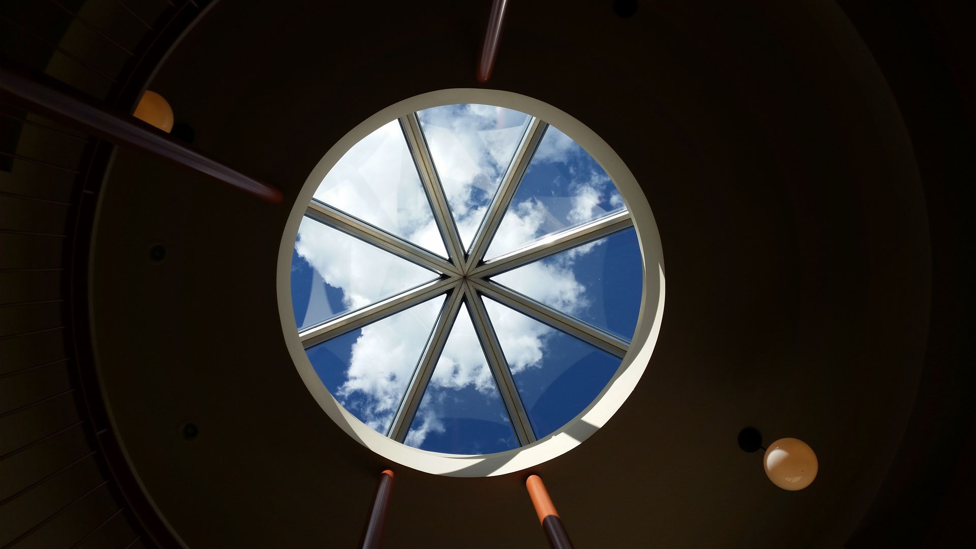 A circular skylight photographed from below.
